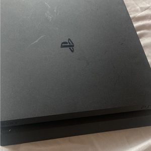 PS4 slim 500gb used with a couple of games but no controller all cords